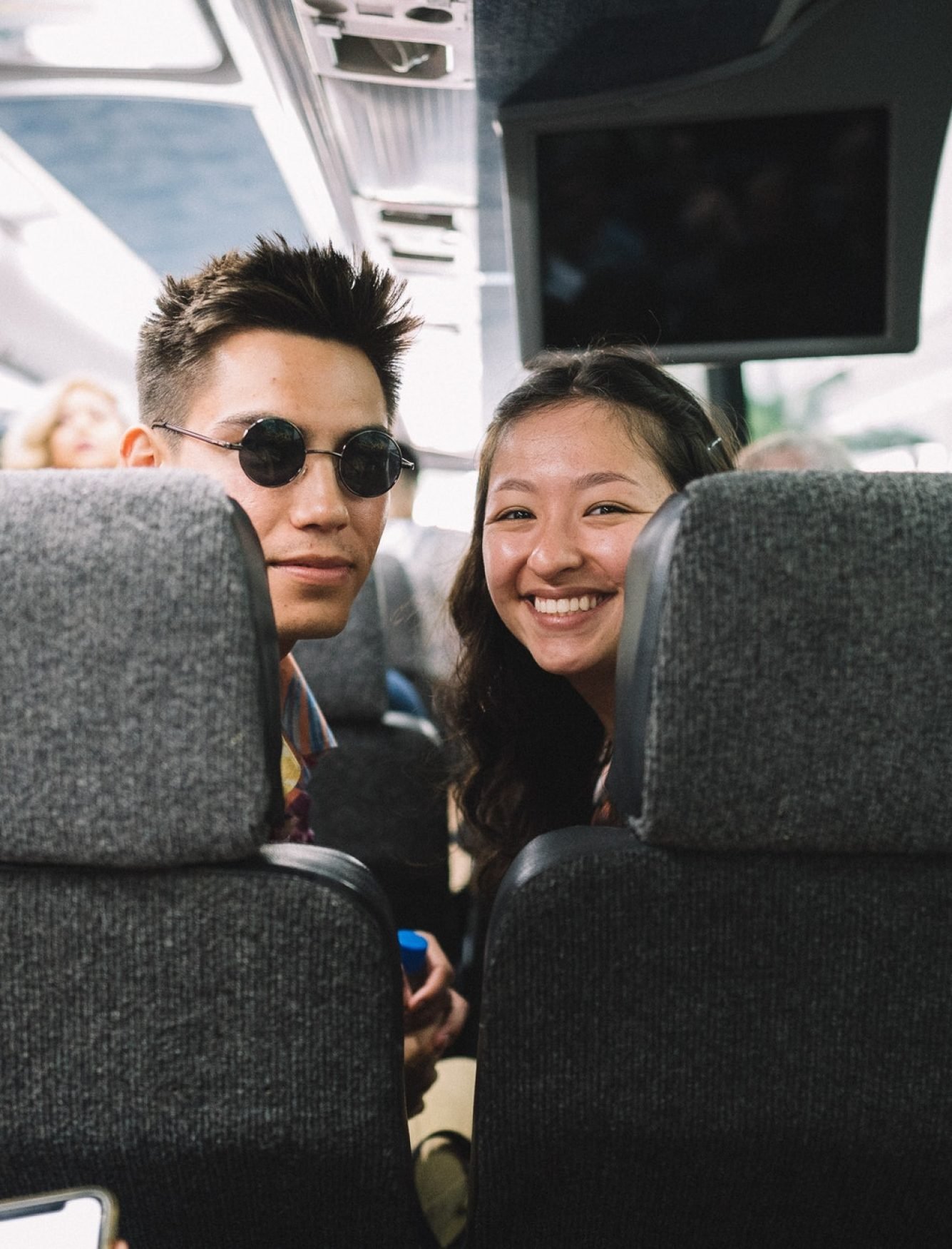 young-couple-traveling-on-a-bus.jpg